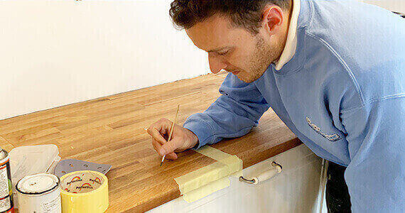 Bath Repair Glasgow - Surface Doctor expert technician performing professional bathtub restoration using advanced repair techniques and precision tools in Glasgow home bathroom